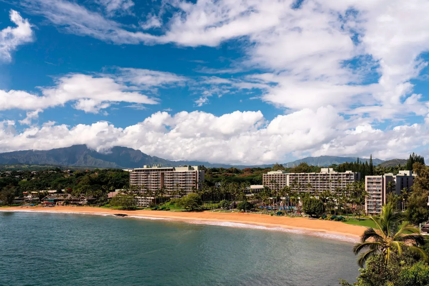 Beachfront resort buildings along the bay at The Royal Sonesta Kaua'i Resort Lihue.