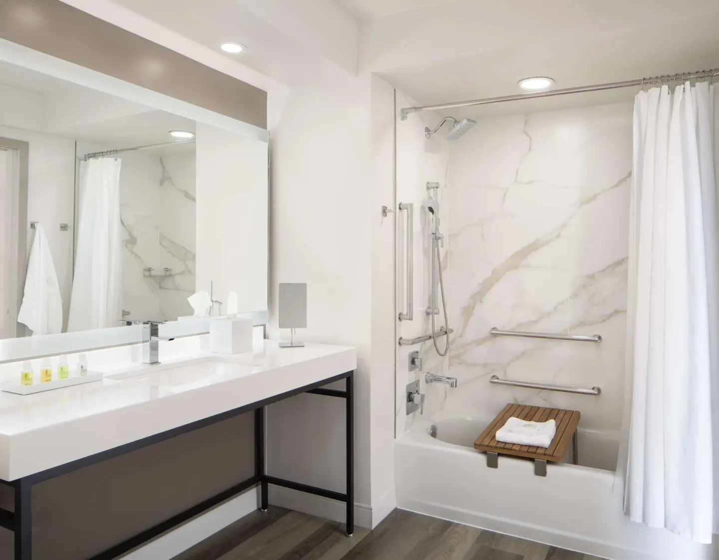 Guest bathroom with vanity and tub-shower at The Royal Sonesta Kaua'i Resort Lihue.