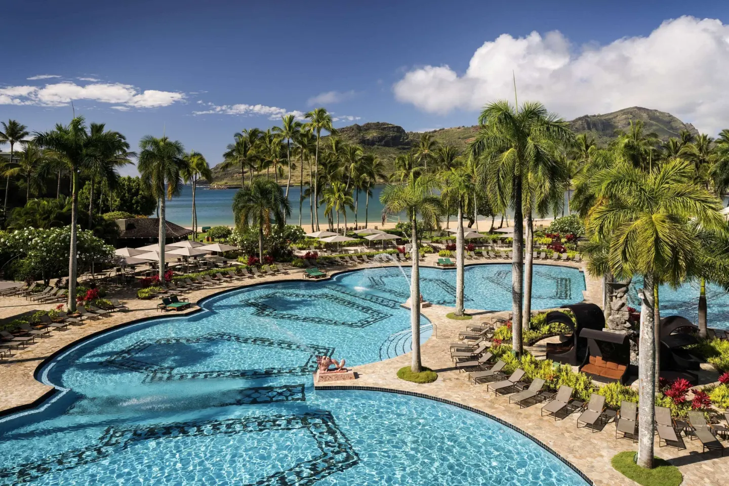 Lagoon-style pool and palm trees at The Royal Sonesta Kaua'i Resort Lihue.