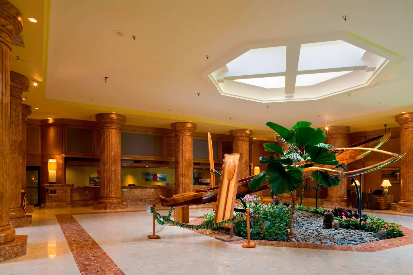 Lobby canoe display and wood columns at The Royal Sonesta Kaua'i Resort Lihue.