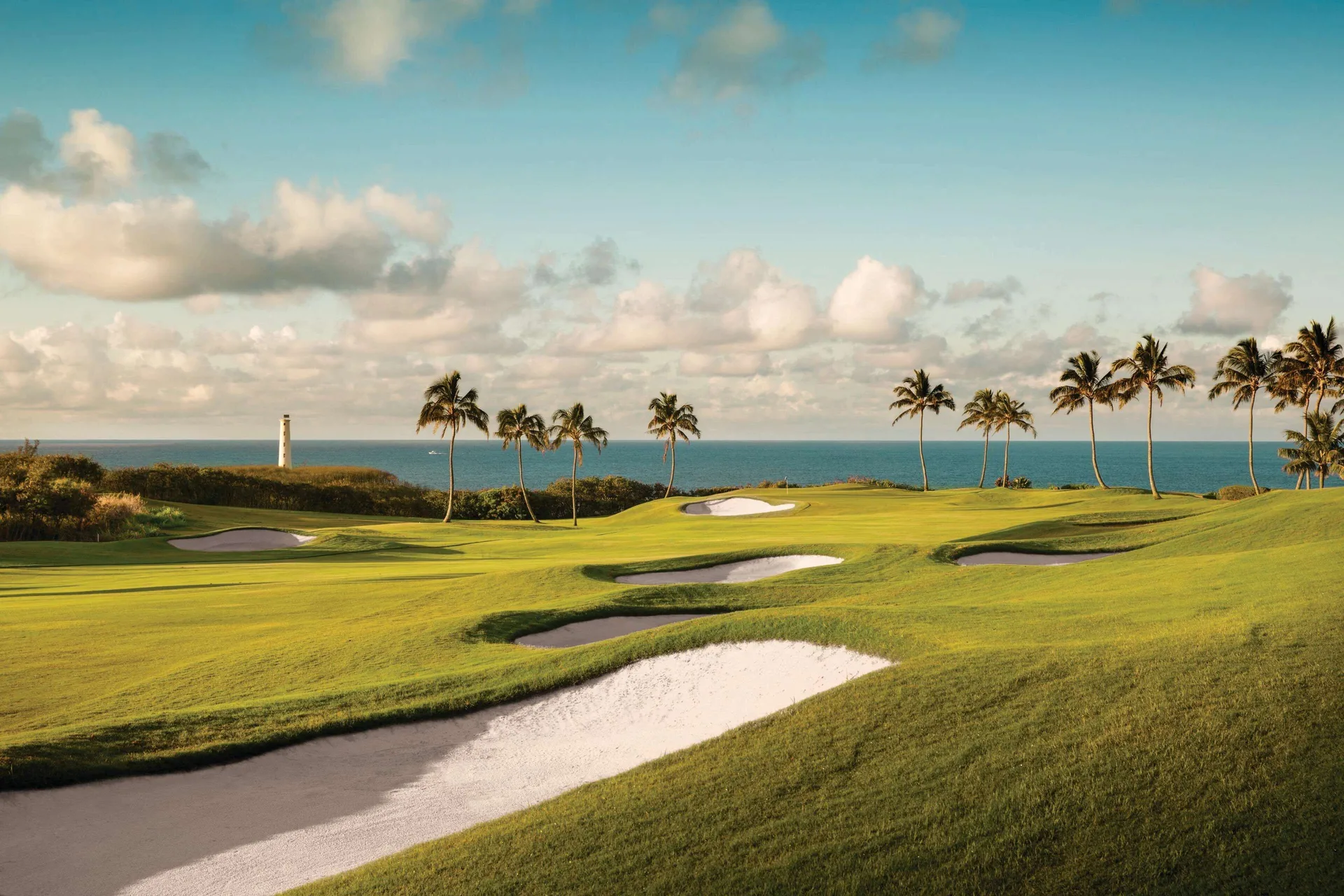 Golf course fairway with ocean and palm trees at The Royal Sonesta Kaua'i Resort Lihue.