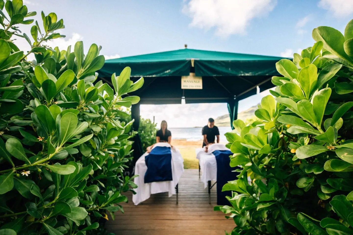 Outdoor massage tables under a canopy near the beach at The Royal Sonesta Kaua'i Resort Lihue.