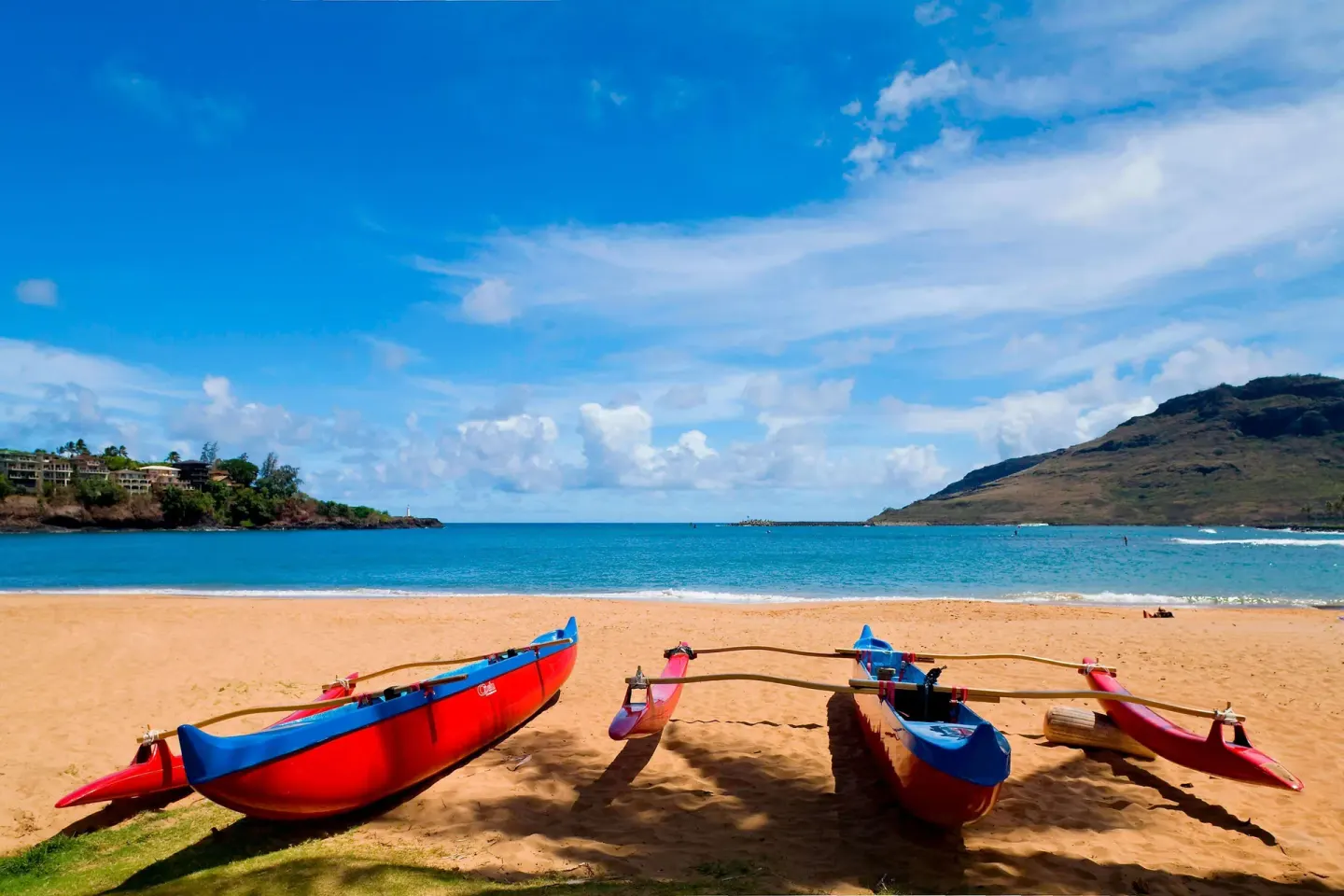Outrigger canoes on the beach at The Royal Sonesta Kaua'i Resort Lihue.