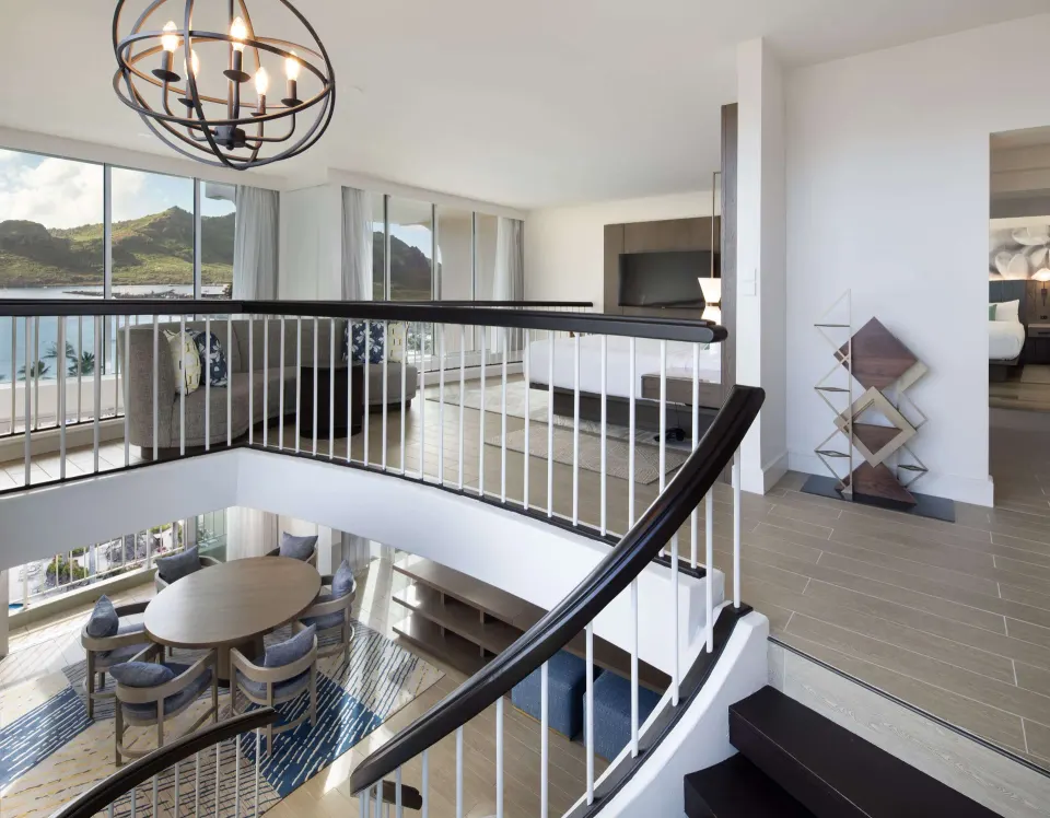 Oceanfront Presidential Suite loft bedroom at The Royal Sonesta Kaua'i Resort Lihue with ocean-view railing.