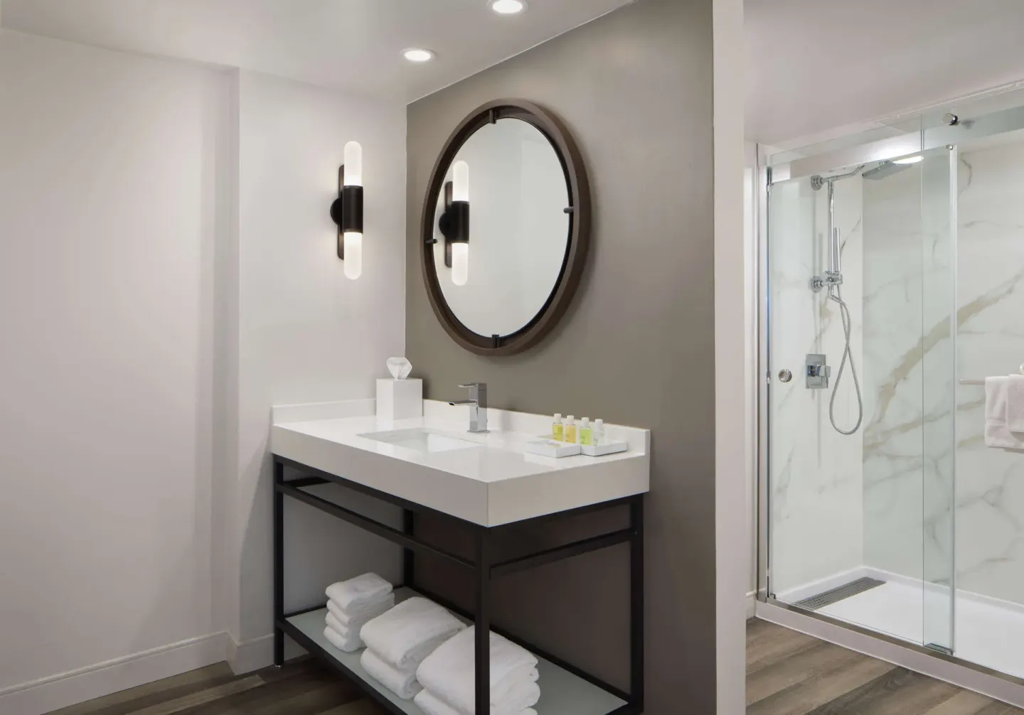 Guest room bathroom vanity and glass shower at The Royal Sonesta Kaua'i Resort Lihue.