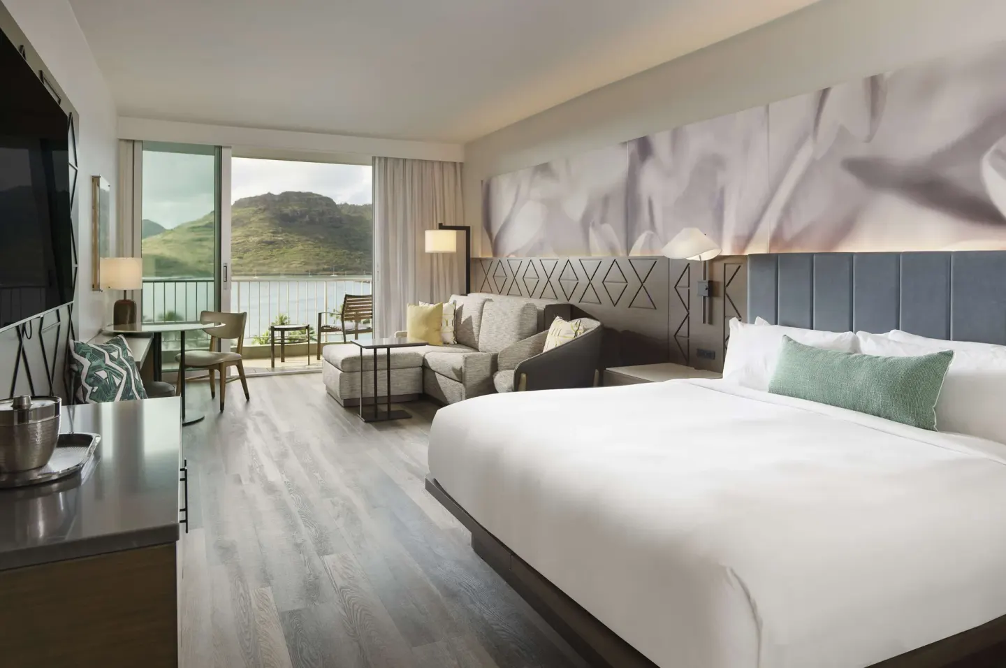 Ocean view guest room with king bed and balcony at The Royal Sonesta Kaua'i Resort Lihue.