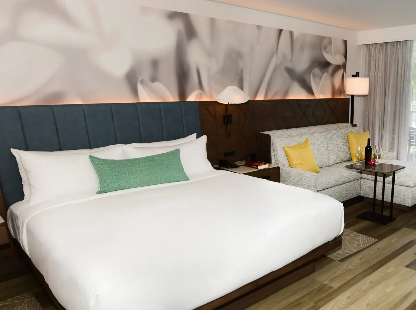 Oceanfront one-bedroom suite king bed and sofa at The Royal Sonesta Kaua'i Resort Lihue.
