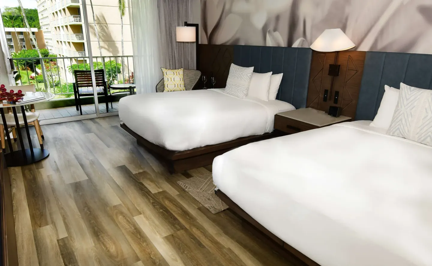 Two queen beds and balcony in a garden view room at The Royal Sonesta Kaua'i Resort Lihue.