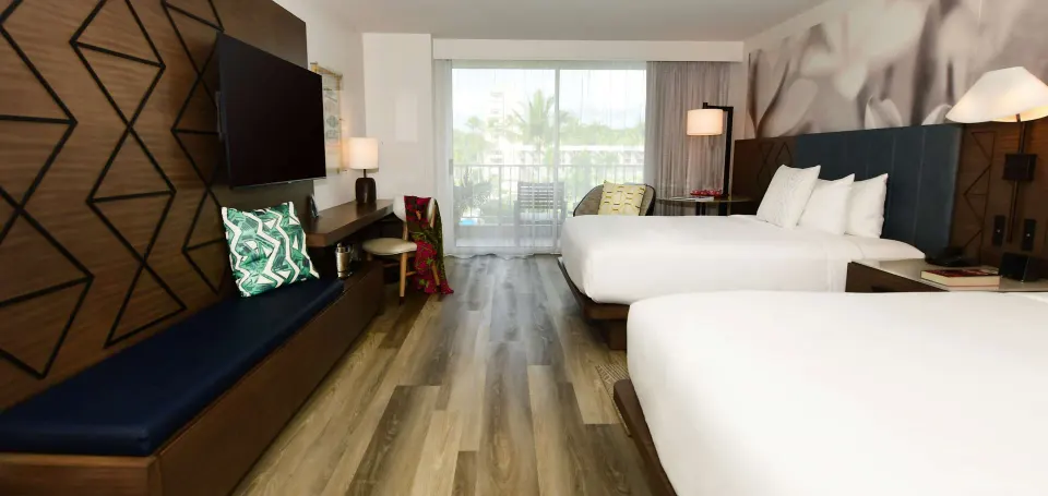 Two Queens Pool View room with beds and balcony at The Royal Sonesta Kaua'i Resort Lihue.