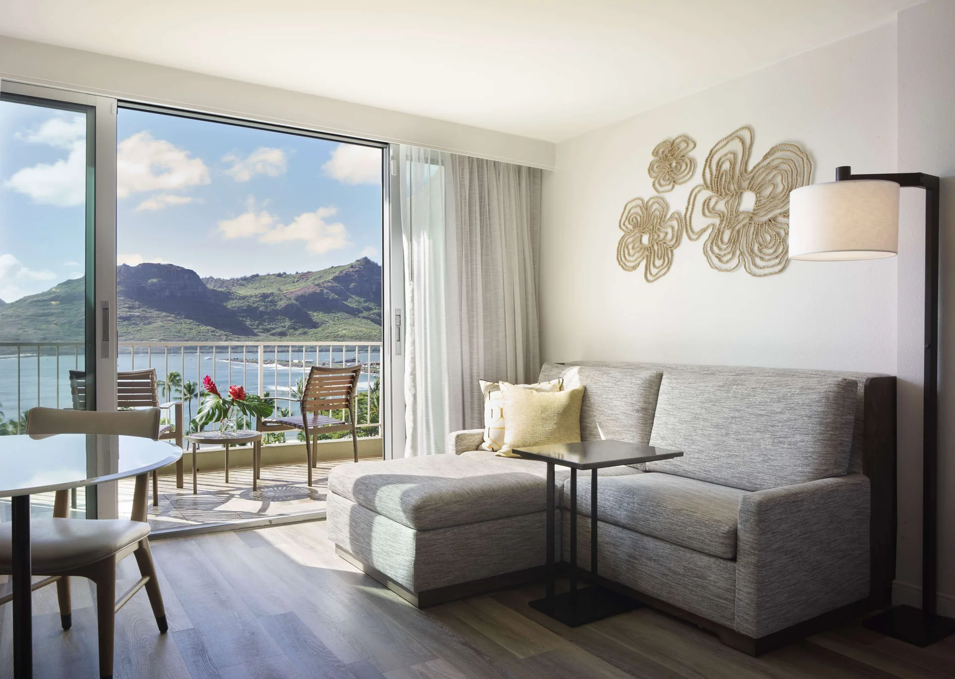 Ocean-view sitting area and balcony in a two-queen room at The Royal Sonesta Kaua'i Resort Lihue.