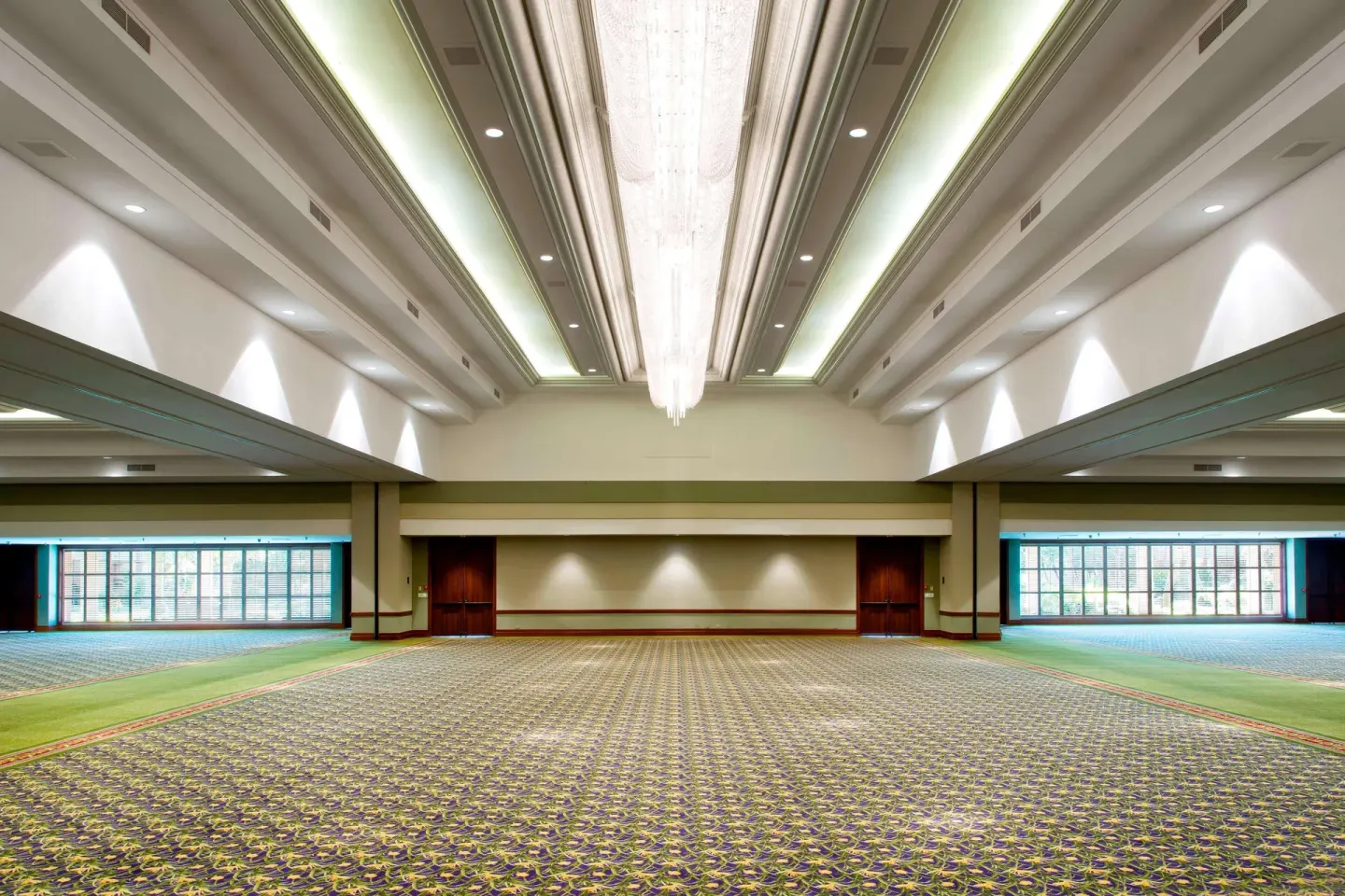 Large empty ballroom with patterned carpet at The Royal Sonesta Kaua'i Resort Lihue.