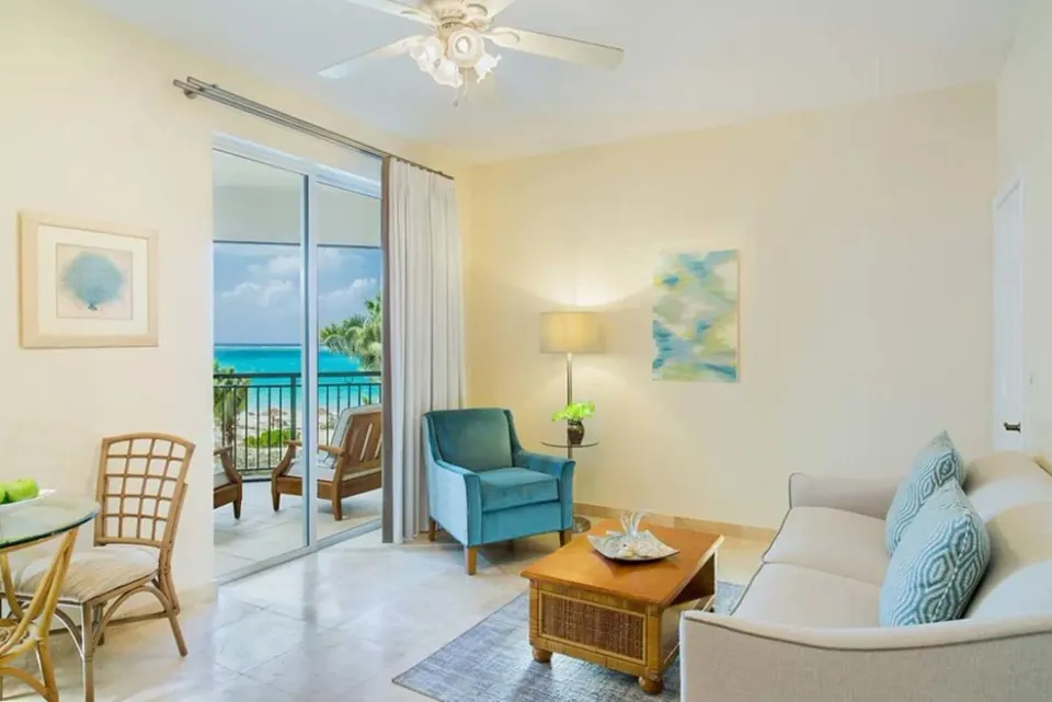 Two Bedroom Suite sitting area with balcony and ocean view at The Sands at Grace Bay.