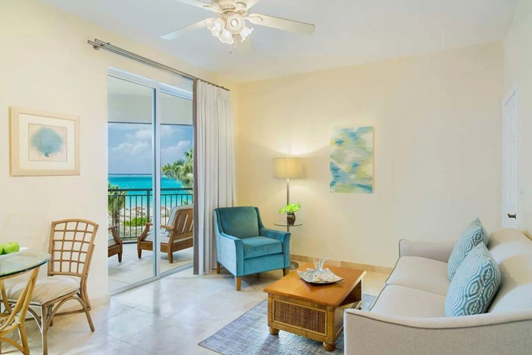 Two Bedroom Suite sitting area with balcony and ocean view at The Sands at Grace Bay.