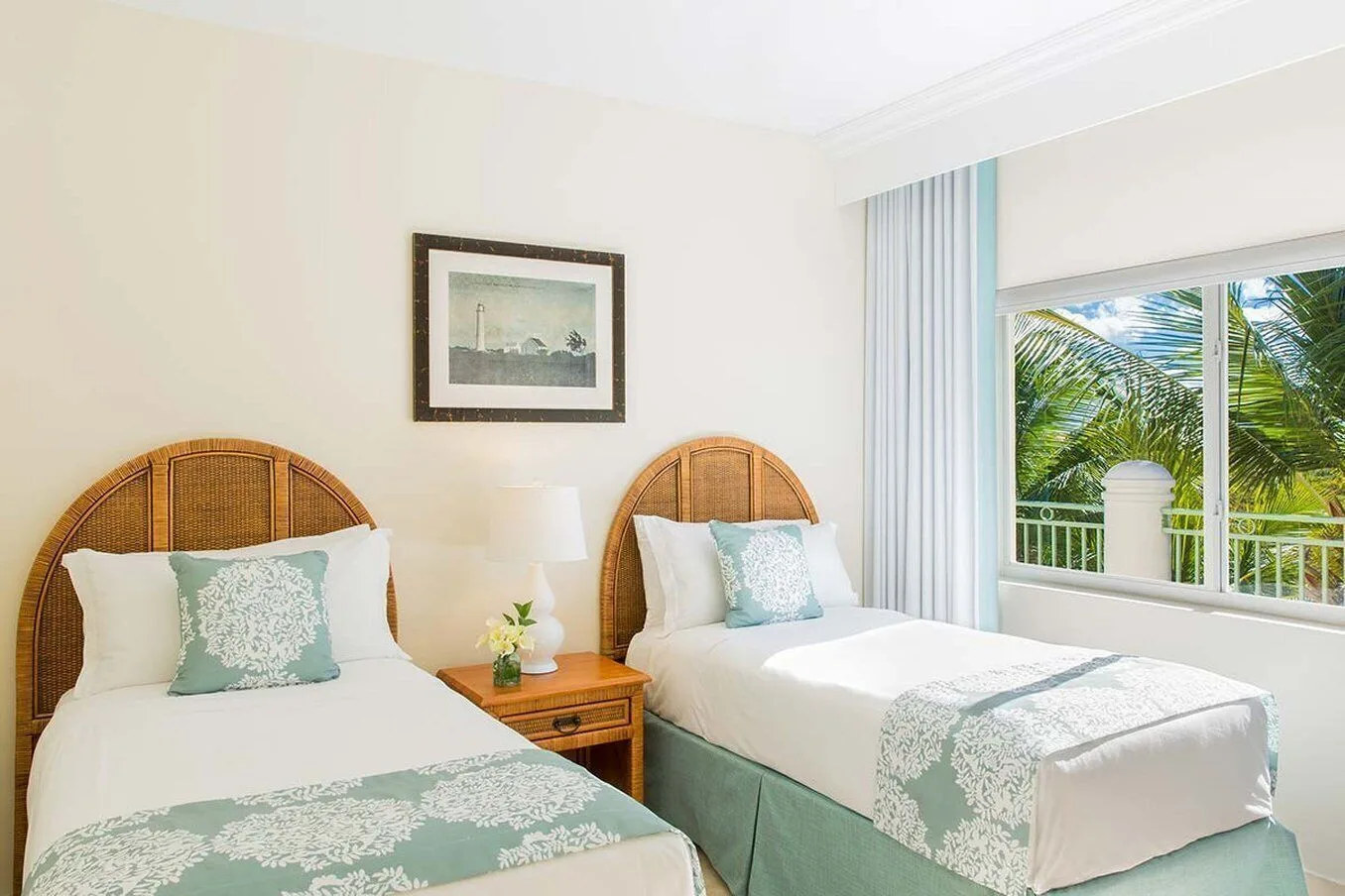 Two Bedroom Suite with two twin beds and palm view at The Sands at Grace Bay.