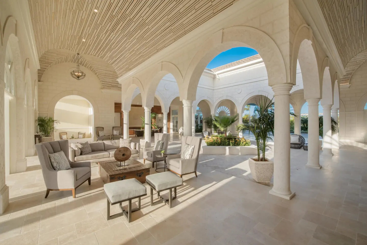 Open-air lounge with arches and sofas at The Shore Club Turks and Caicos.