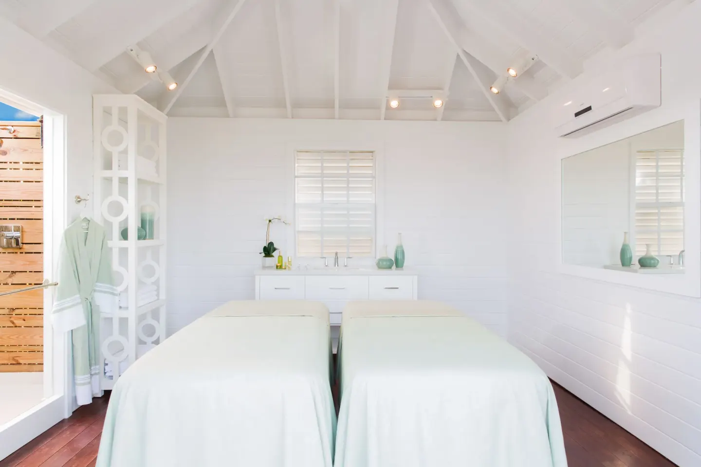 Bright spa treatment room with two massage tables at The Shore Club Turks and Caicos.