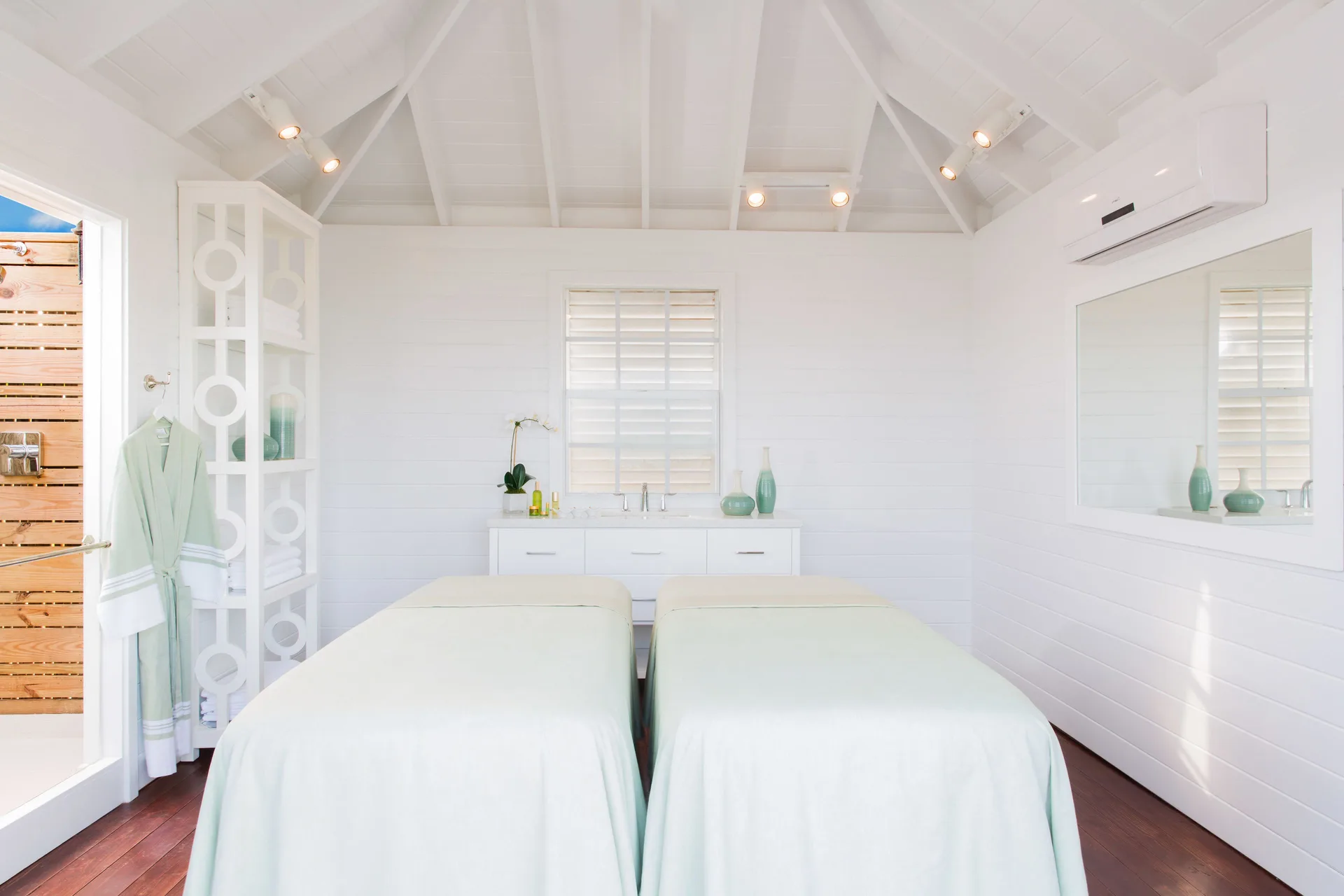 Bright spa treatment room with two massage tables at The Shore Club Turks and Caicos.