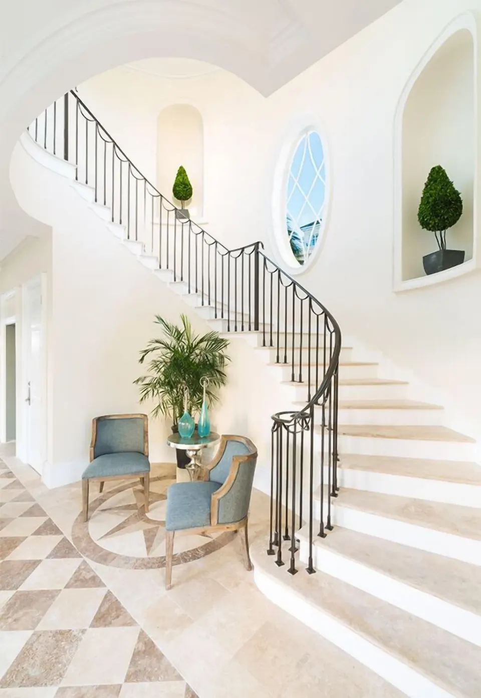 Luxury Villa staircase at The Shore Club Turks and Caicos with curved railing and seating nook.