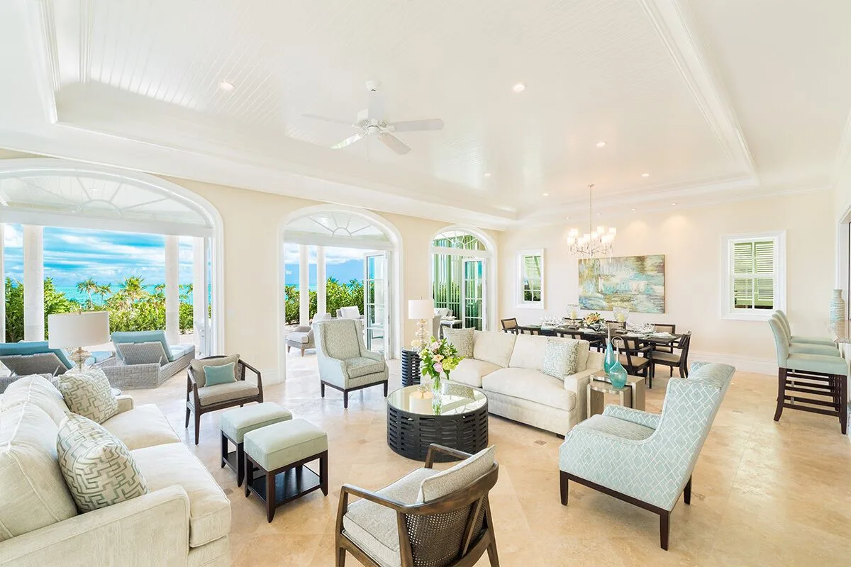 Luxury villa living and dining room with ocean-facing arches at The Shore Club Turks and Caicos.
