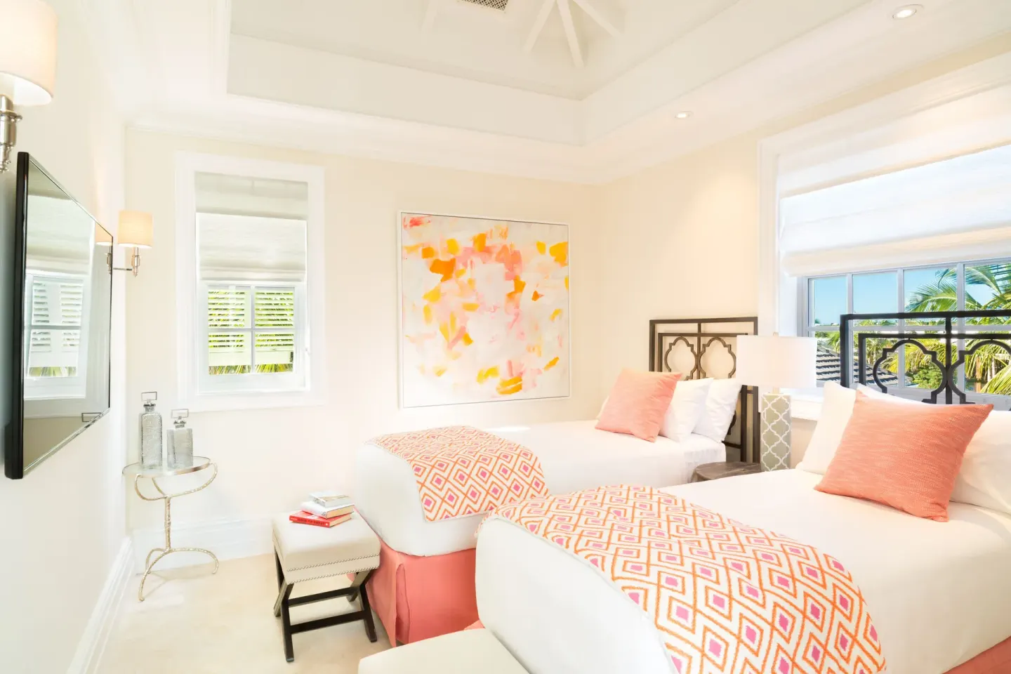 Twin bedroom in a Luxury Villa at The Shore Club Turks and Caicos with coral accents and abstract art.