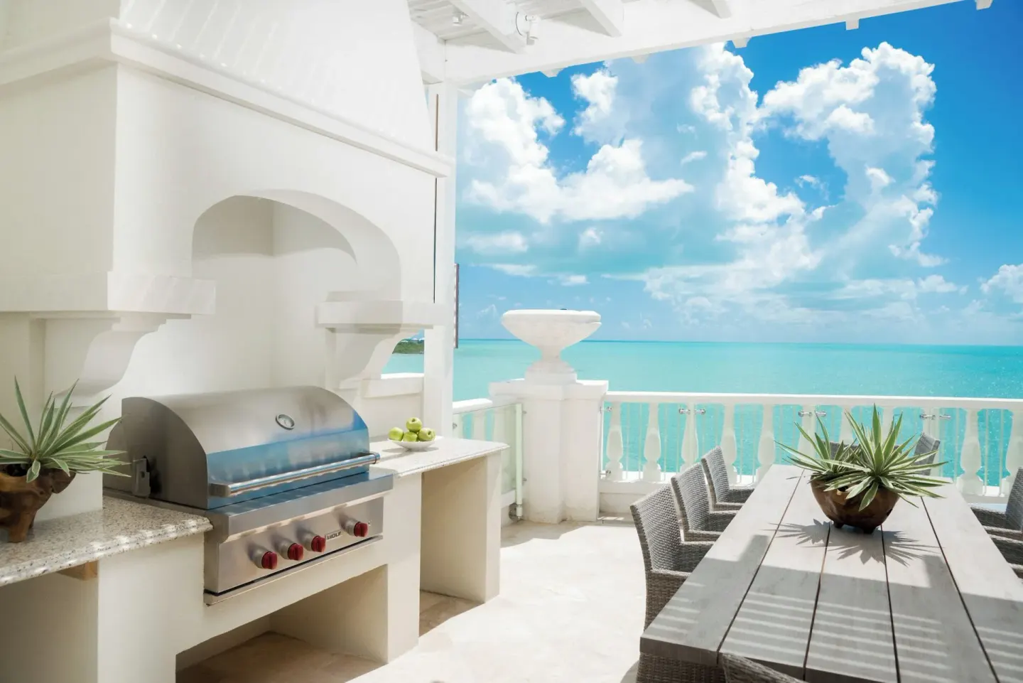 Penthouse terrace grill and dining area with ocean view at The Shore Club Turks and Caicos.