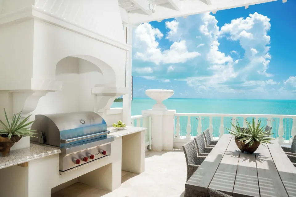 Penthouse terrace grill and dining area with ocean view at The Shore Club Turks and Caicos.