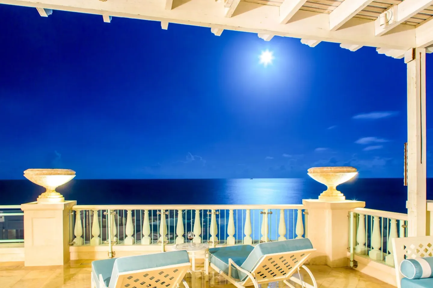 Penthouse terrace loungers under moonlight at The Shore Club Turks and Caicos.