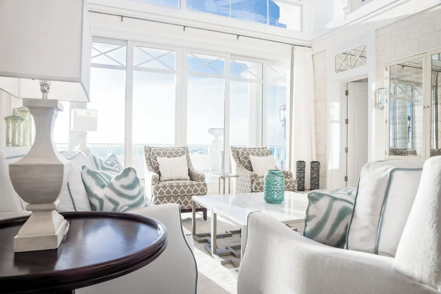 Sunlit penthouse seating area with terrace doors at The Shore Club Turks and Caicos.