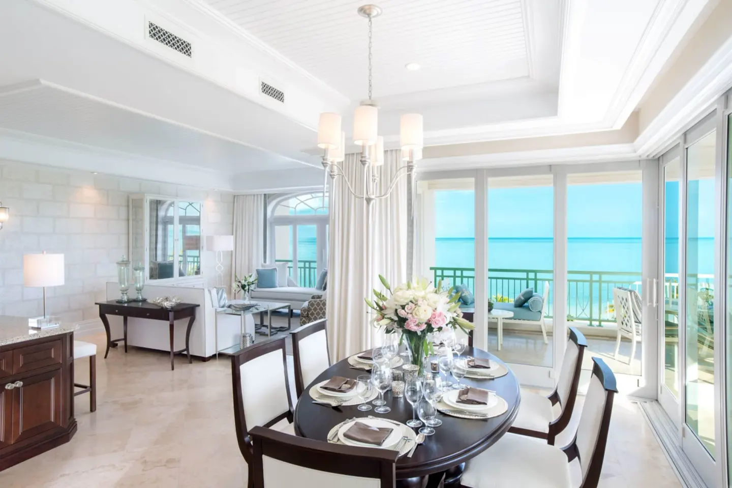 Oceanfront dining area with balcony and sea view at The Shore Club Turks and Caicos.