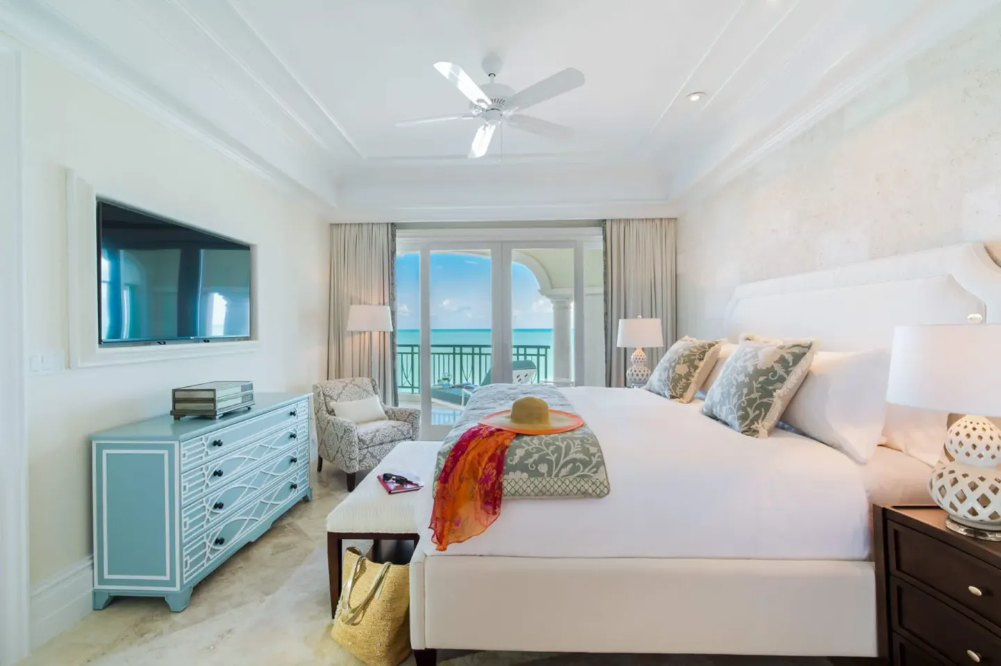 Oceanfront one-bedroom suite with king bed and balcony view at The Shore Club Turks and Caicos.