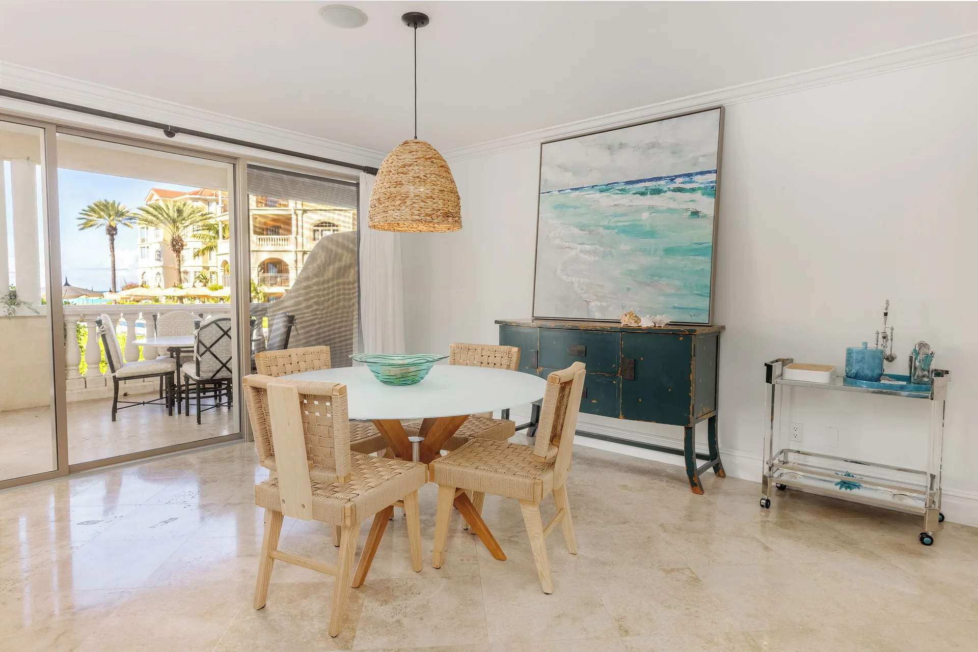 Villa 1 Bedroom Pool View dining area and balcony at The Somerset on Grace Bay.