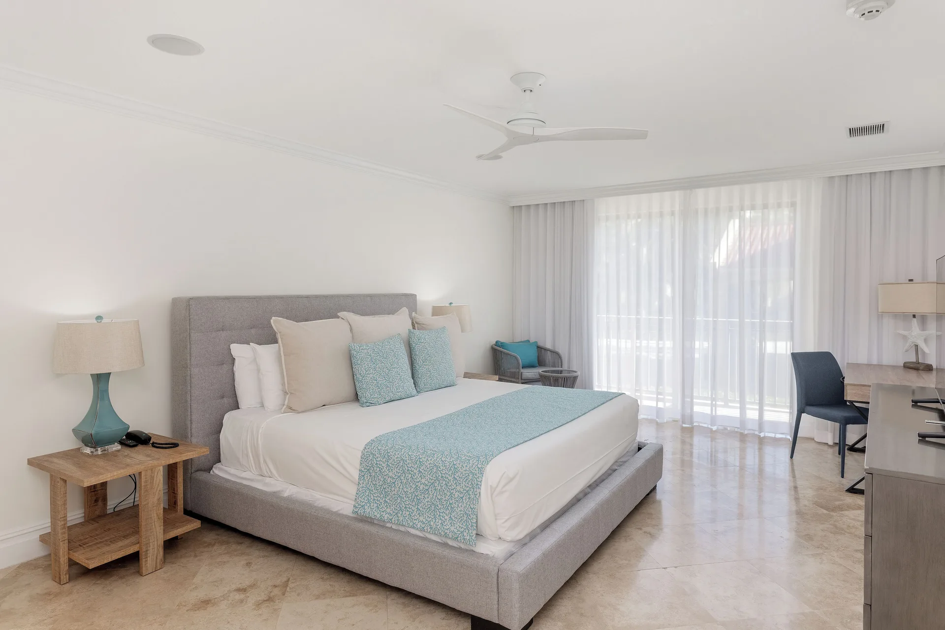 Villa 1 Bedroom Pool View king bed and desk at The Somerset on Grace Bay.