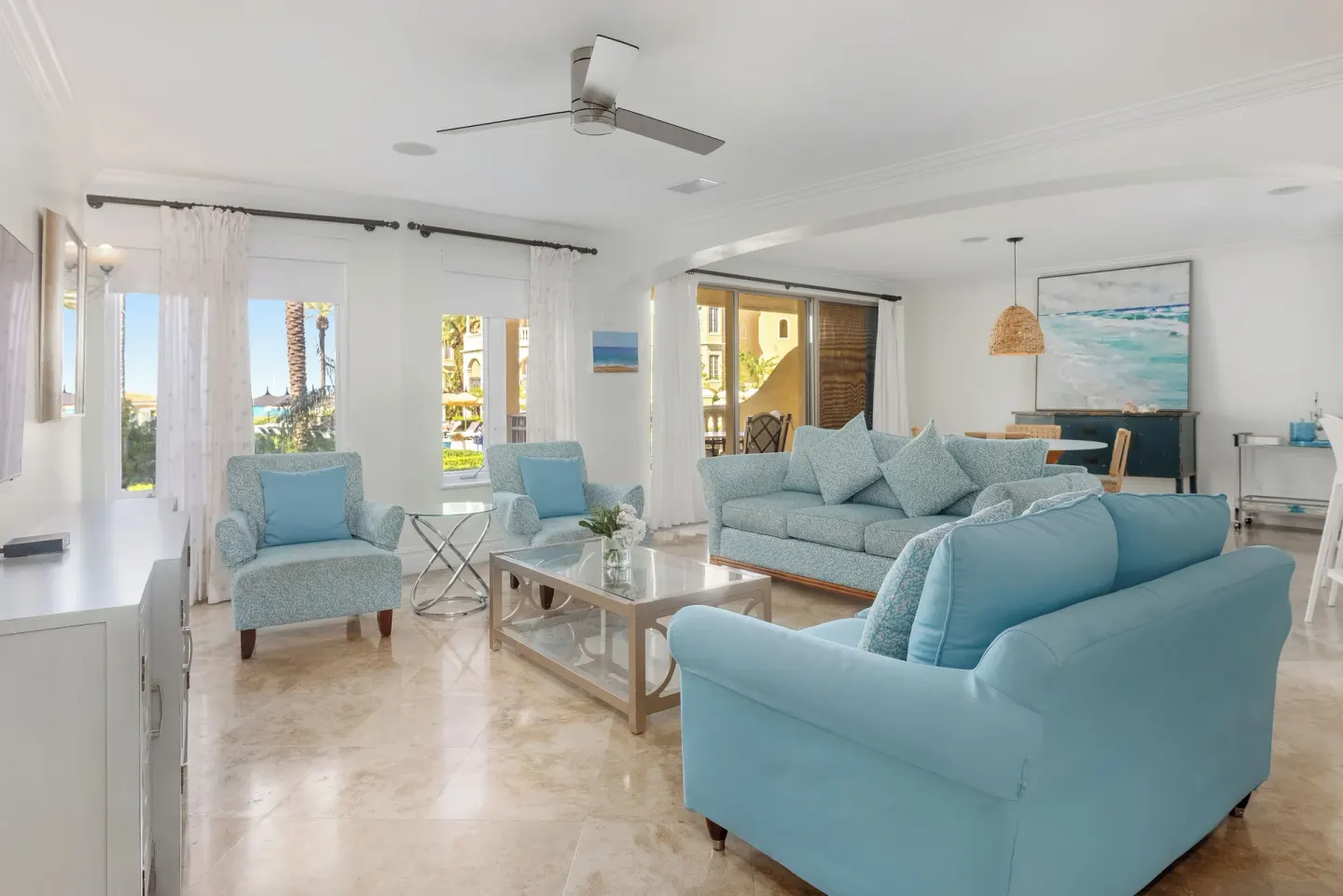 Villa 1 Bedroom Pool View living room with blue seating at The Somerset on Grace Bay.