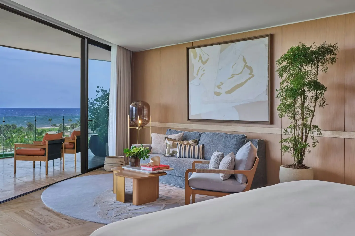 Presidential Suite bedroom seating area with ocean-view balcony at The St Regis Cap Cana Resort.