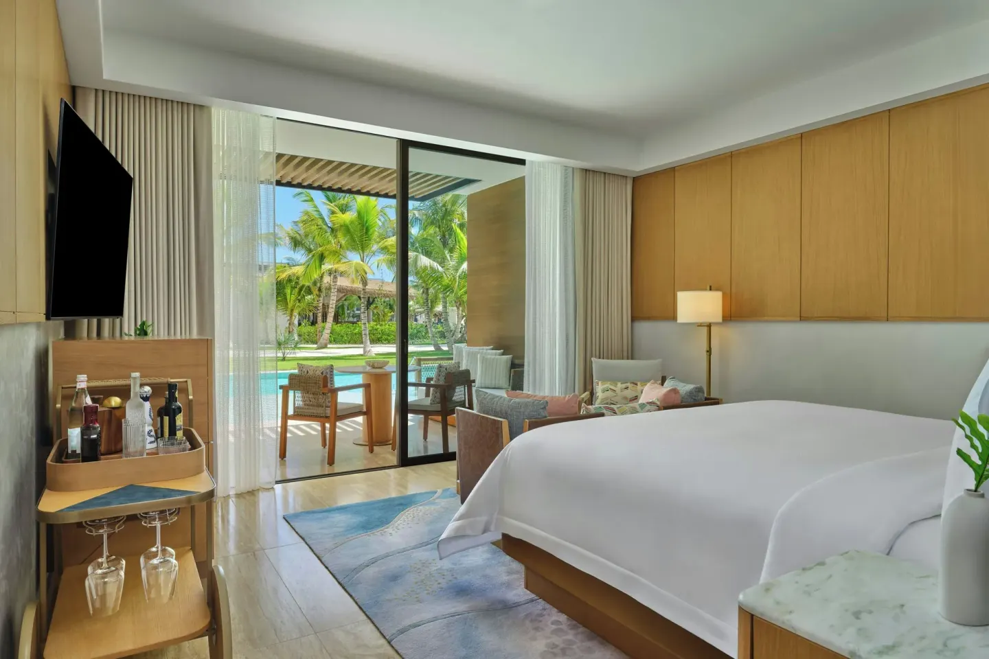 Pool Access Room with king bed and terrace view at The St Regis Cap Cana Resort.