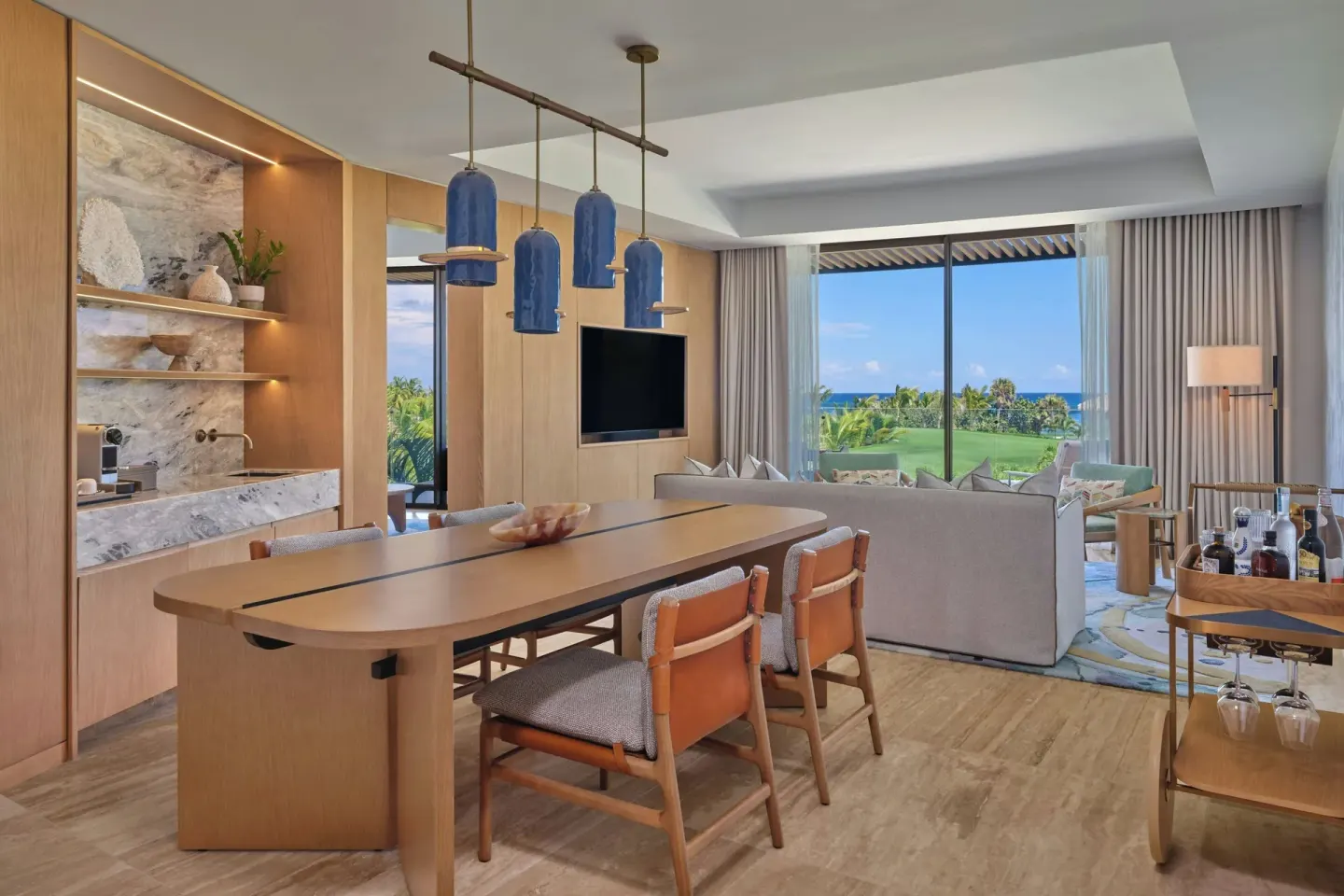 One-bedroom resort view suite dining and living area at The St Regis Cap Cana Resort.