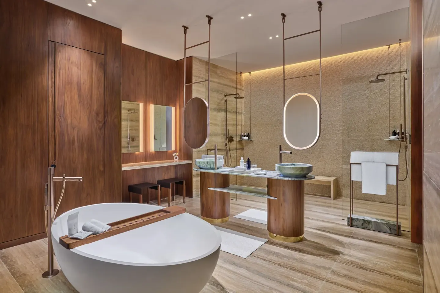 Large bathroom with soaking tub and glass showers at The St. Regis Kanai Resort, Riviera Maya.
