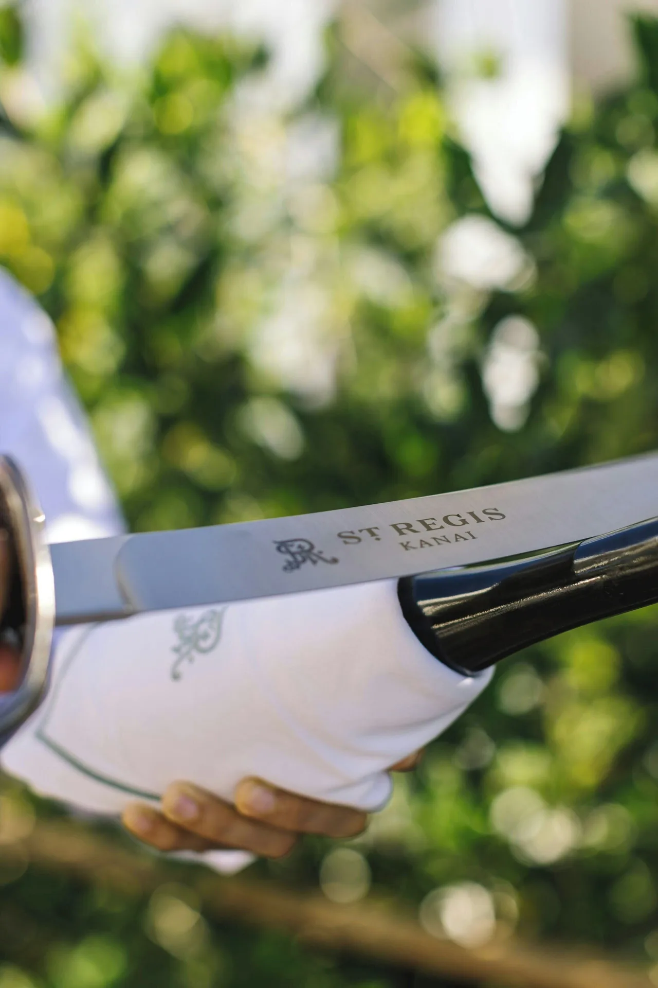 Close-up of a ceremonial sabrage sword at The St. Regis Kanai Resort, Riviera Maya.