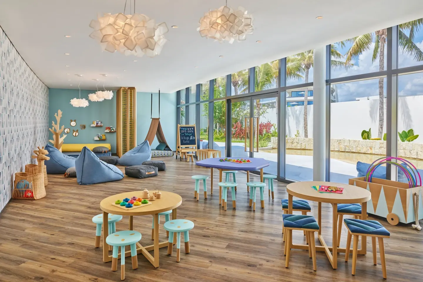 Children's club playroom with activity tables at The St. Regis Kanai Resort, Riviera Maya.