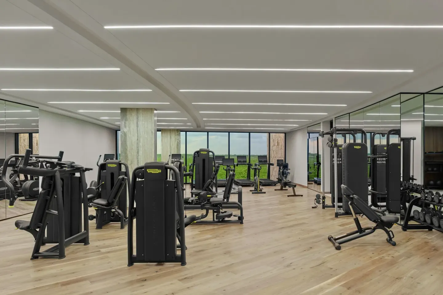 Fitness center with cardio and weight equipment at The St. Regis Kanai Resort, Riviera Maya.