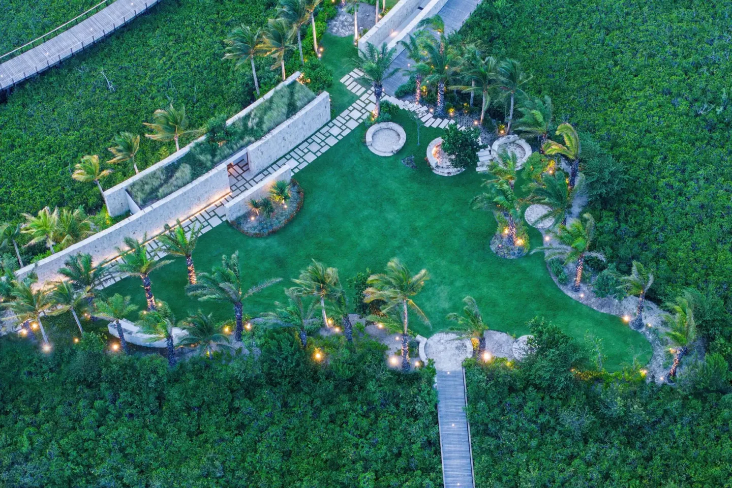 Aerial view of a landscaped event lawn in greenery at The St. Regis Kanai Resort, Riviera Maya.
