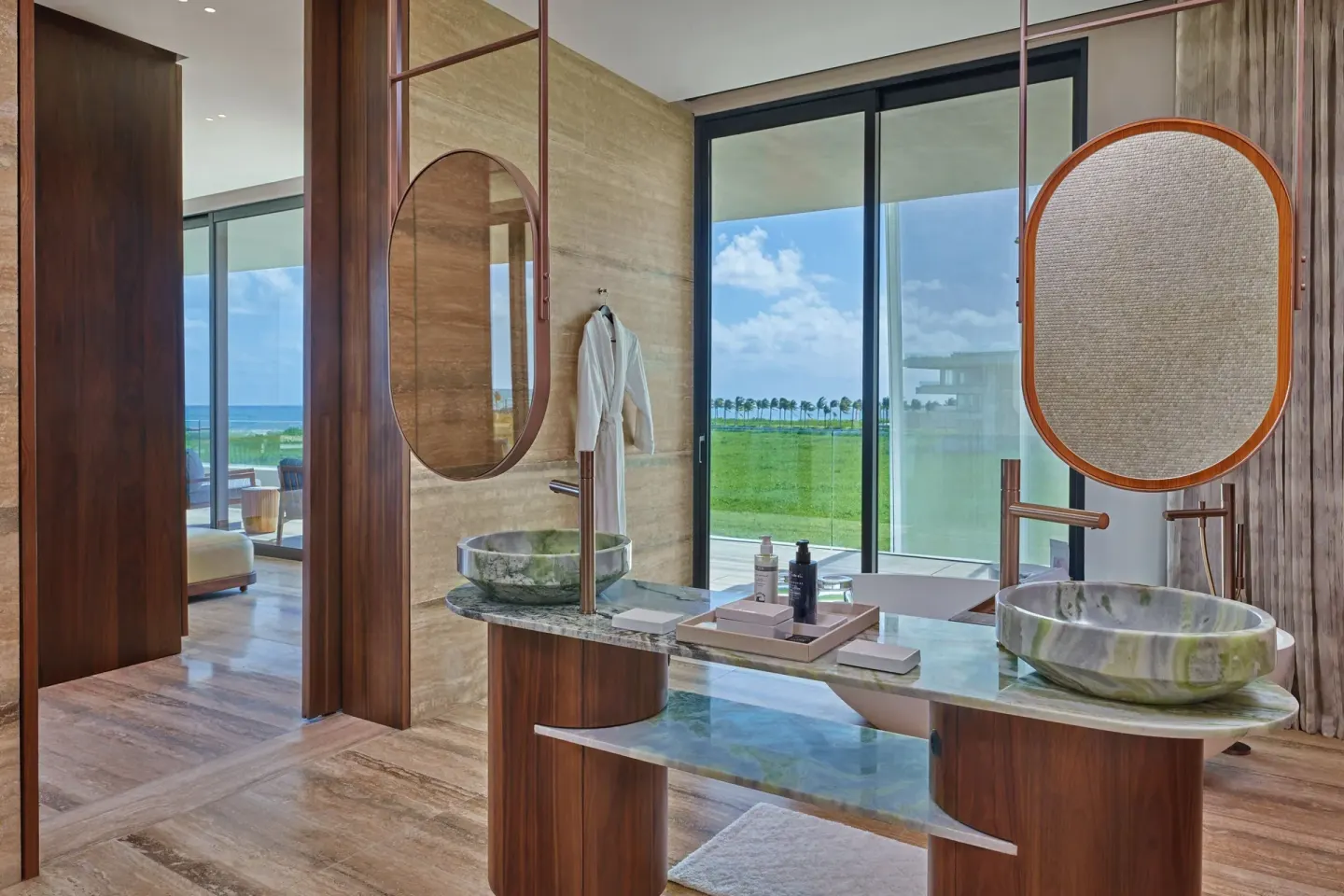 Bathroom vanities with ocean-facing windows at The St. Regis Kanai Resort, Riviera Maya.