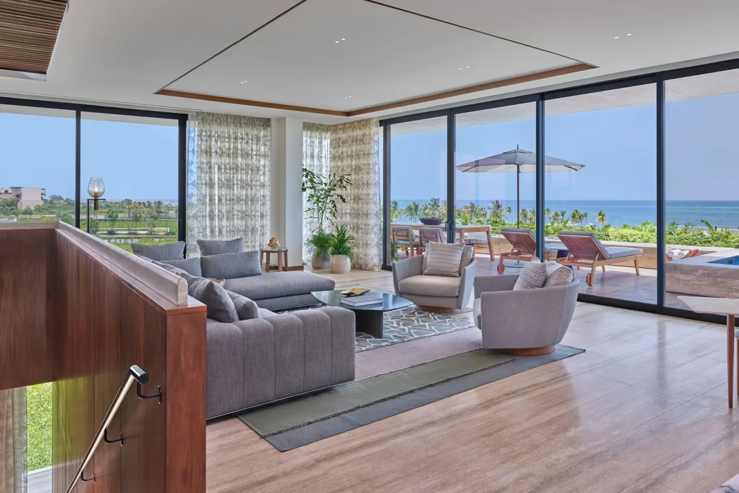 Ocean-view suite lounge with terrace beyond at The St. Regis Kanai Resort, Riviera Maya.