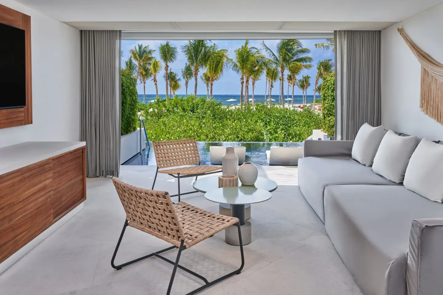 Ocean-facing living area with terrace pool at The St. Regis Kanai Resort, Riviera Maya.