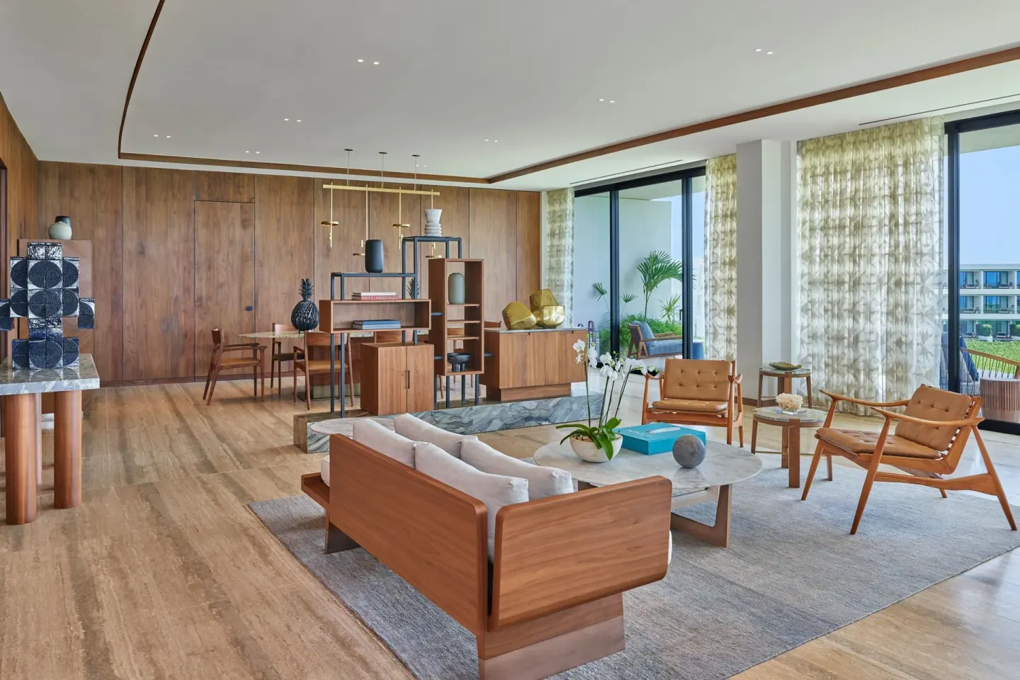 Suite living and dining area with balcony windows at The St. Regis Kanai Resort, Riviera Maya.