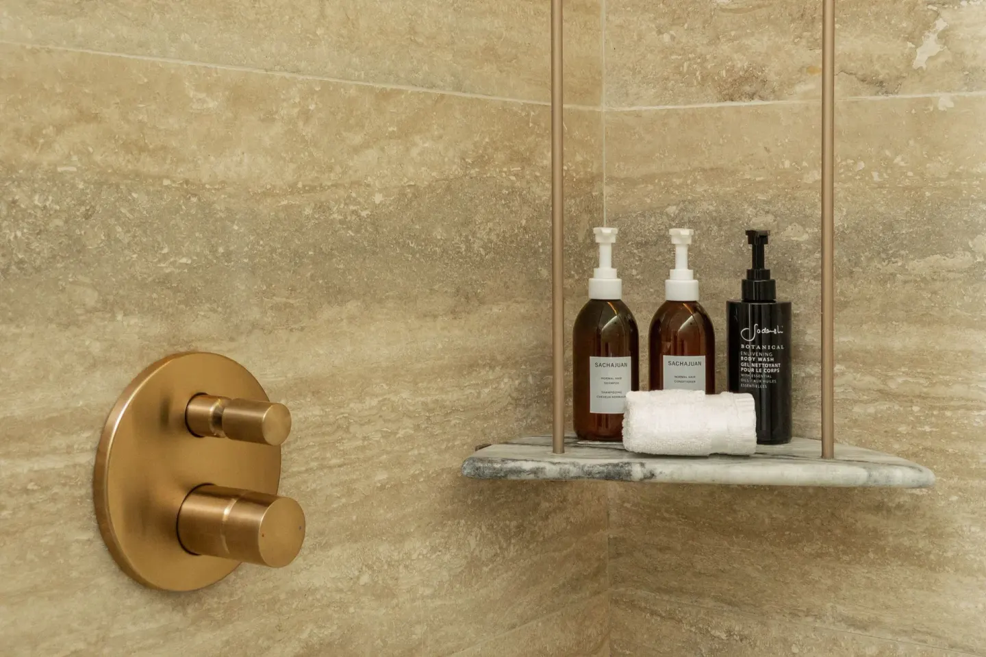 Shower shelf with bath amenities in a Grand Room at The St. Regis Kanai Resort, Riviera Maya.
