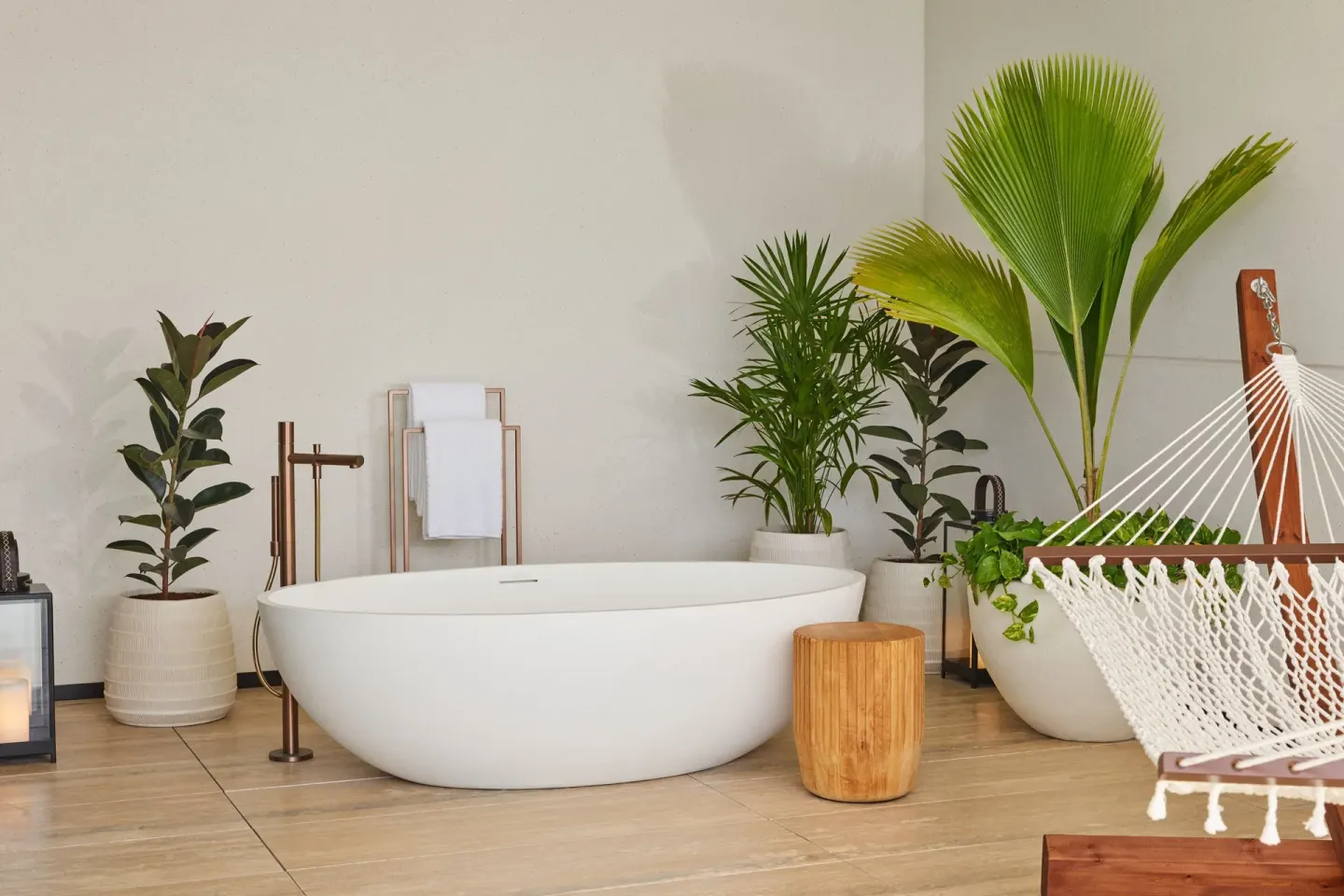 Balcony soaking tub with plants and hammock at The St. Regis Kanai Resort, Riviera Maya.