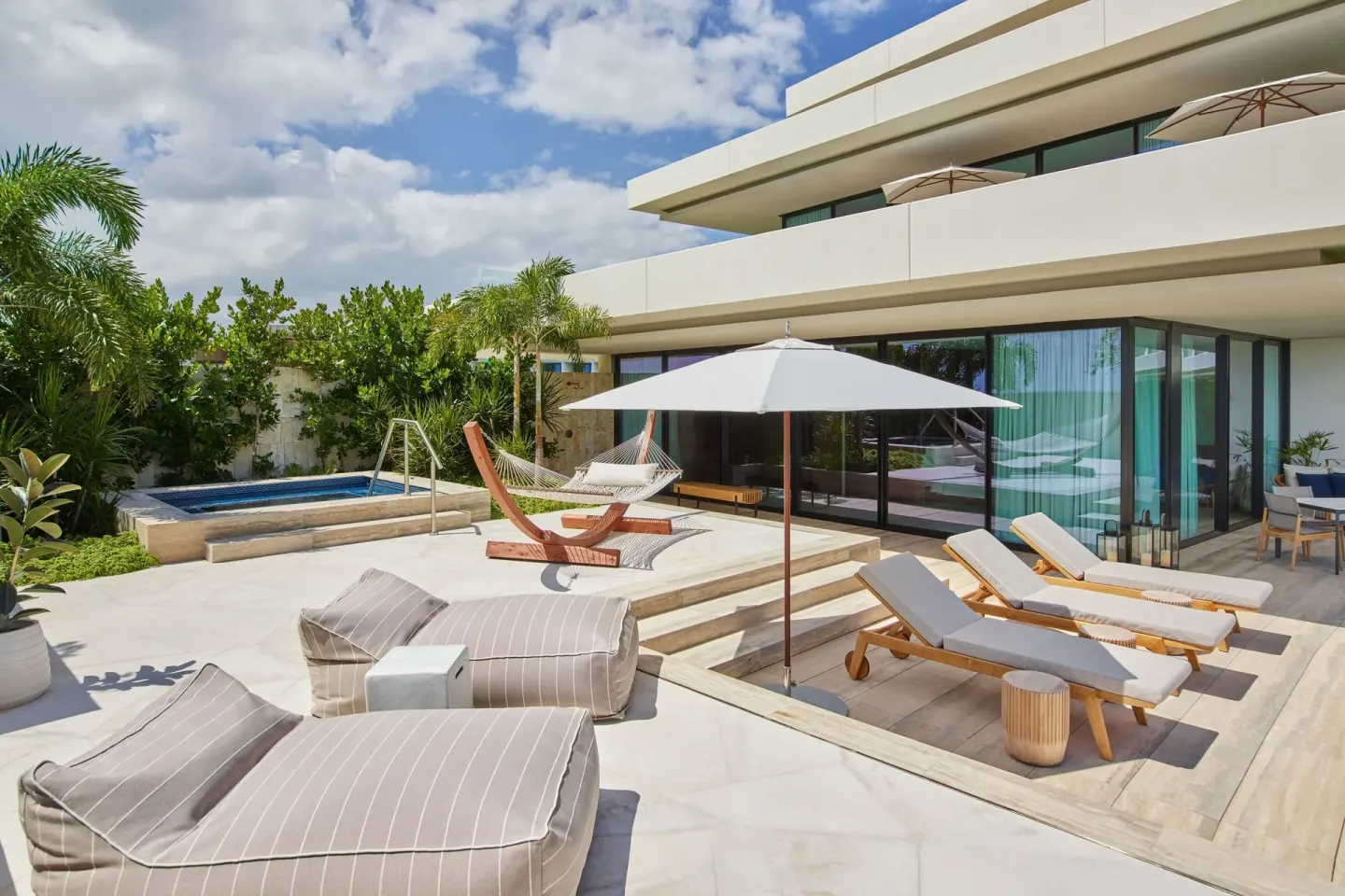 Private terrace with loungers, hammock and plunge pool at The St. Regis Kanai Resort, Riviera Maya.