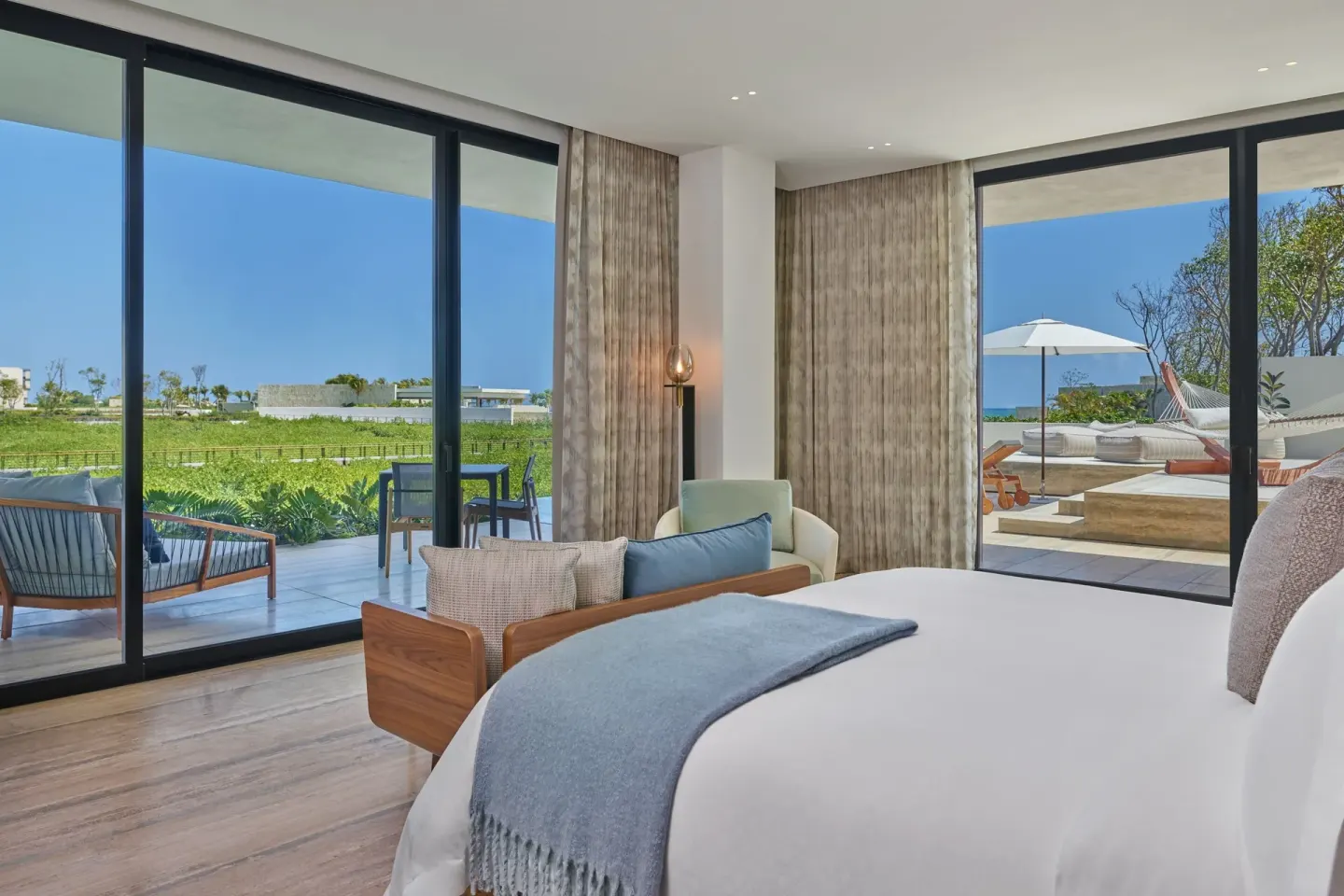 Studio Ocean View corner room with king bed and two glass walls at The St. Regis Kanai Resort, Riviera Maya.