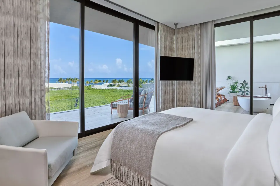 Ocean View Suite king bed at The St. Regis Kanai Resort, Riviera Maya with terrace and bathtub